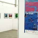 Poster dedicato alla fiera e sullo sfondo la mostra fotografica.